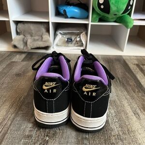 Nike Air Force 1s Black and Gold Sneakers